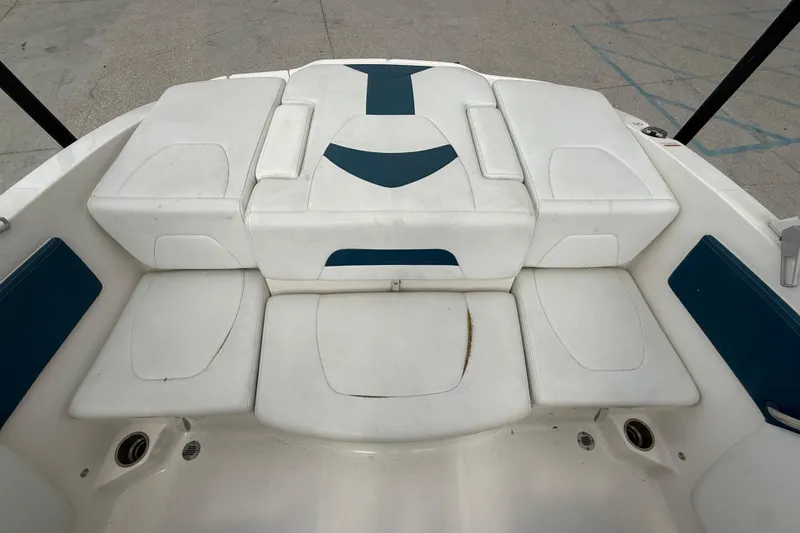 Slide: The Image of 2016 Chaparral H20 21 Deluxe boat interior with white and blue seating. - 12