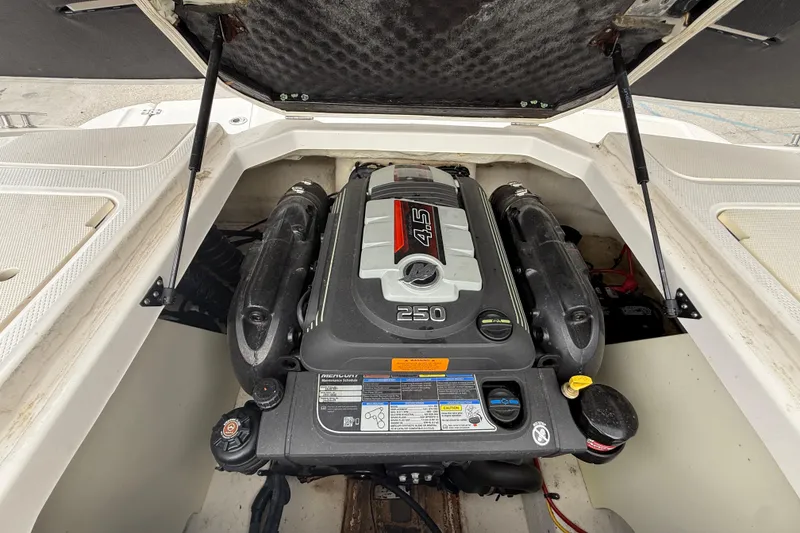 Slide: The Image of 2016 Chaparral H20 21 Deluxe boat engine compartment with 4.5L 250 horsepower engine. - 17