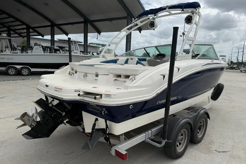 Slide: The Image of 2016 Chaparral H20 21 Deluxe boat on trailer, parked outdoors. - 6