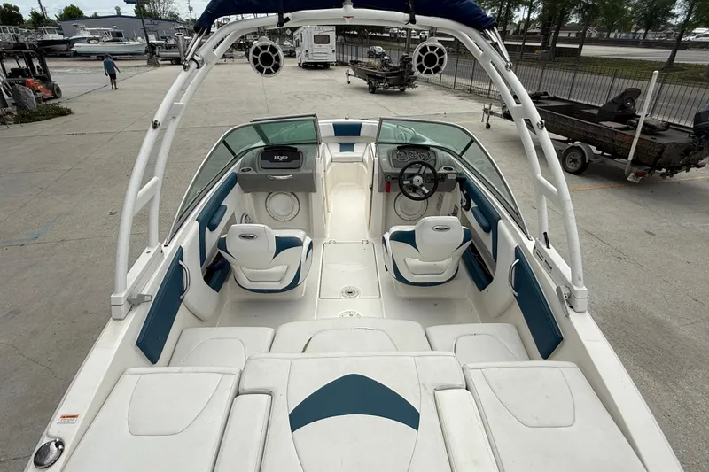 Slide: The Image of 2016 Chaparral H20 21 Deluxe boat interior with seating and steering wheel. - 7