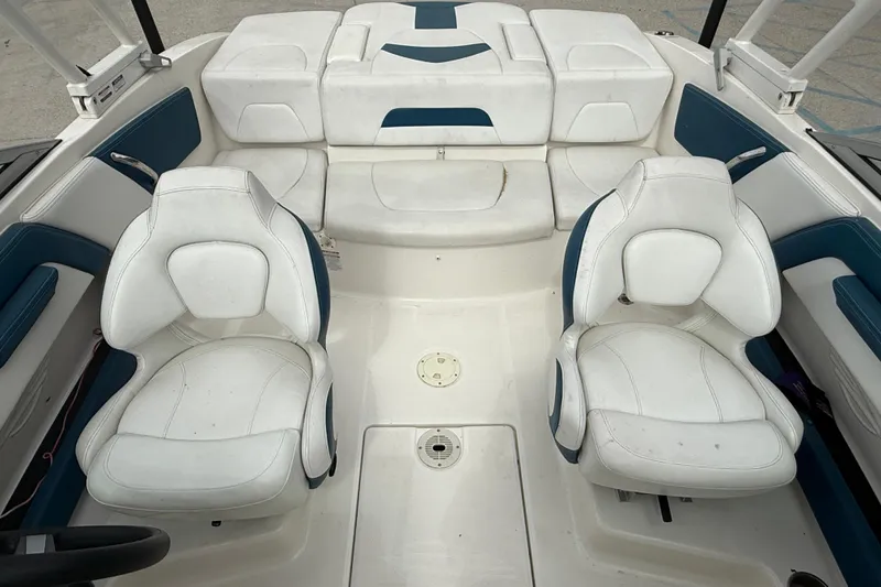 Slide: The Image of 2016 Chaparral H20 21 Deluxe boat interior with white and blue seating. - 9