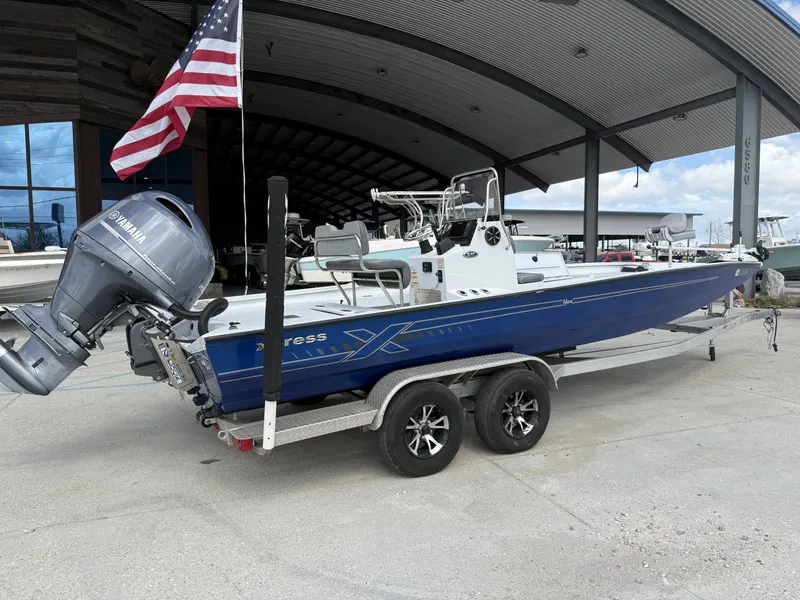 Slide: The Image of 2021 Xpress H24B Bay boat with Yamaha engine on trailer. - 4
