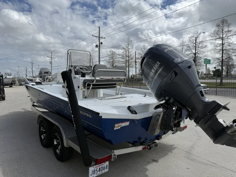 Slide: The Image of 2021 Xpress H24B Bay boat with Yamaha engine on trailer. - 5
