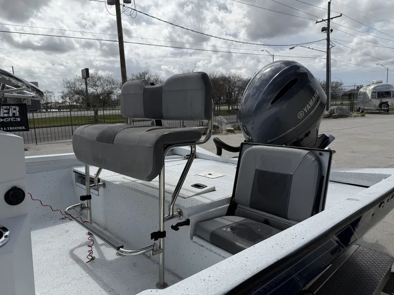 Slide: The Image of 2021 Xpress H24B Bay boat with Yamaha motor, gray seats. - 7