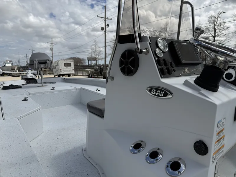 Slide: The Image of 2021 Xpress H24B Bay boat with console and seating area. - 8