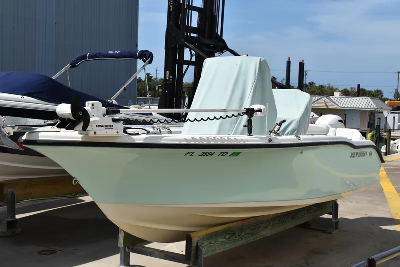 The Image of 2022 Key West 219 FS boat docked, featuring Minn Kota trolling motor. - 0