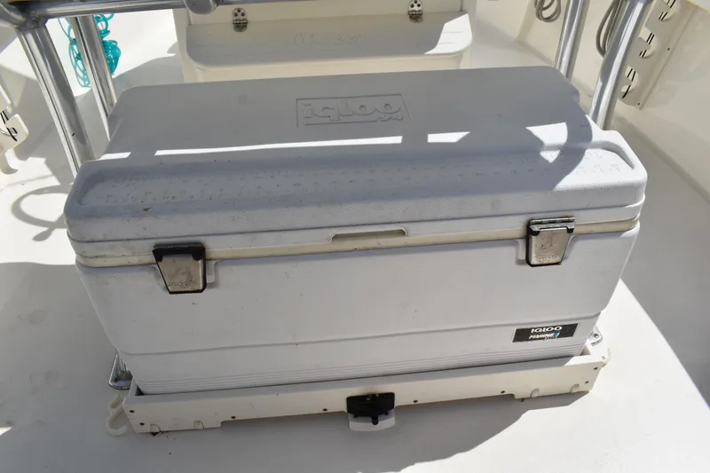 Slide: The Image of Cooler on 2022 Key West 219 FS boat deck, secured with metal latches. - 10