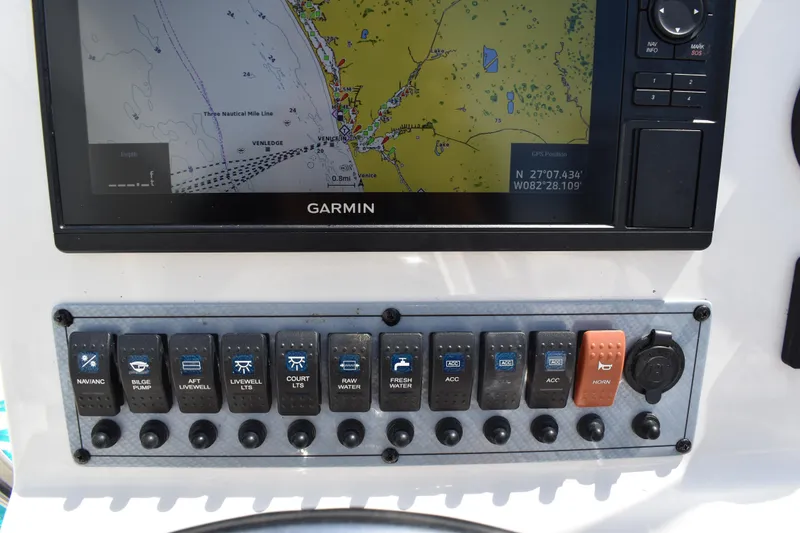 Slide: The Image of Control panel of a 2022 Key West 219 FS boat with Garmin navigation display. - 18