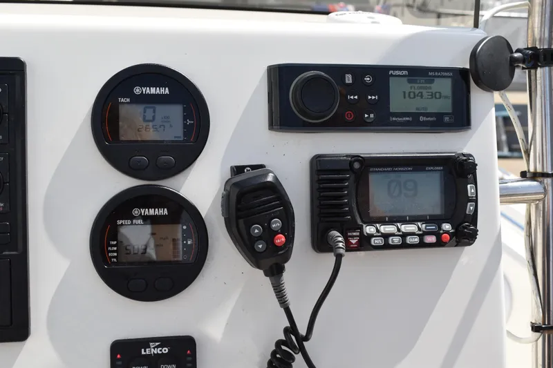 Slide: The Image of Dashboard of 2022 Key West 219 FS boat with Yamaha gauges and communication devices. - 19