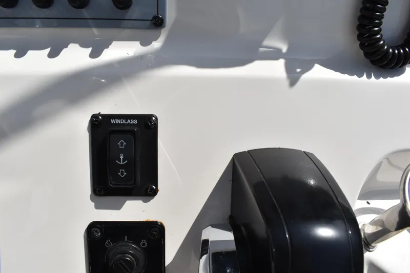 Slide: The Image of Control panel of 2022 Key West 219 FS boat featuring windlass switch. - 21