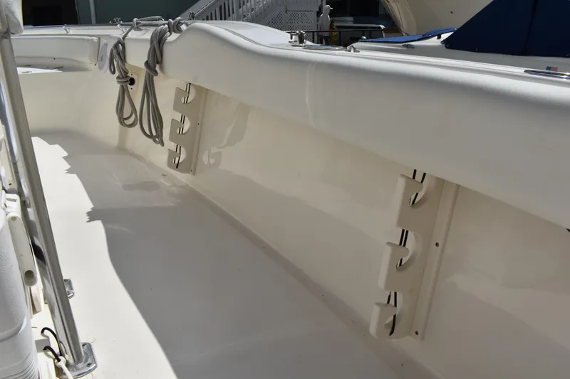 Slide: The Image of 2022 Key West 219 FS boat interior with rod holders and ropes. - 23