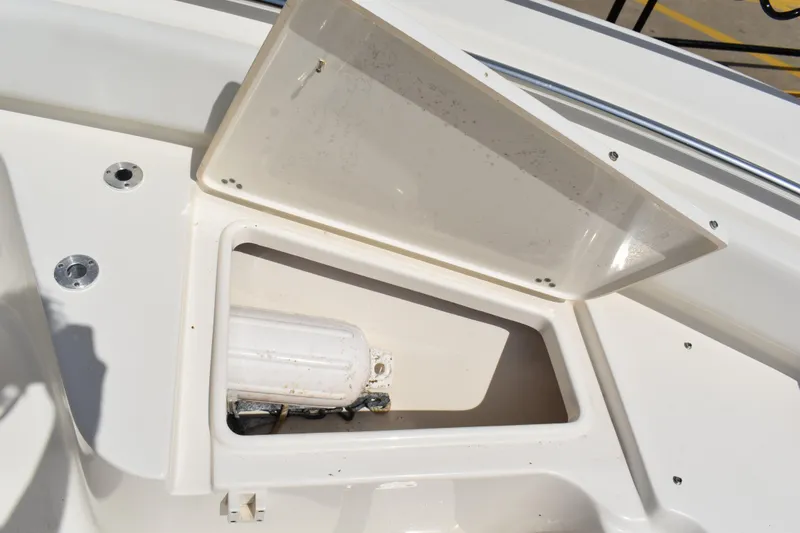 Slide: The Image of Open storage compartment on 2022 Key West 219 FS boat deck. - 28