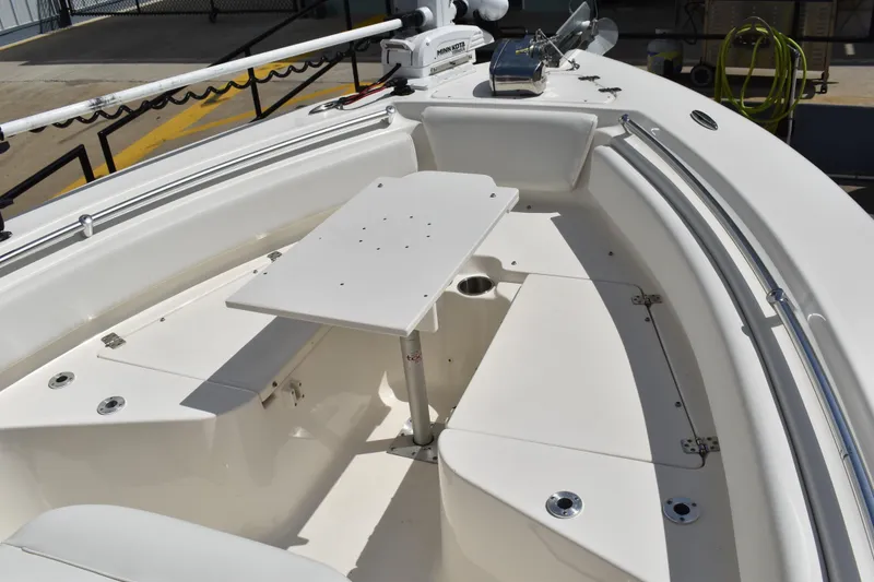 Slide: The Image of 2022 Key West 219 FS boat interior with seating and table setup. - 29