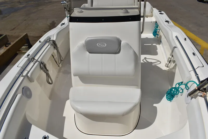Slide: The Image of 2022 Key West 219 FS boat interior with white seating and deck details. - 37