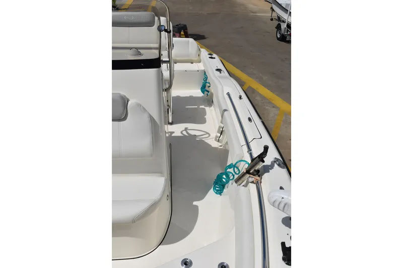 Slide: The Image of 2022 Key West 219 FS boat interior with seating and coiled hoses. - 38