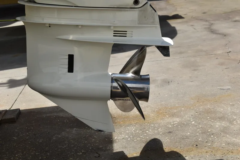 Slide: The Image of Outboard motor propeller of 2022 Key West 219 FS boat on concrete surface. - 42