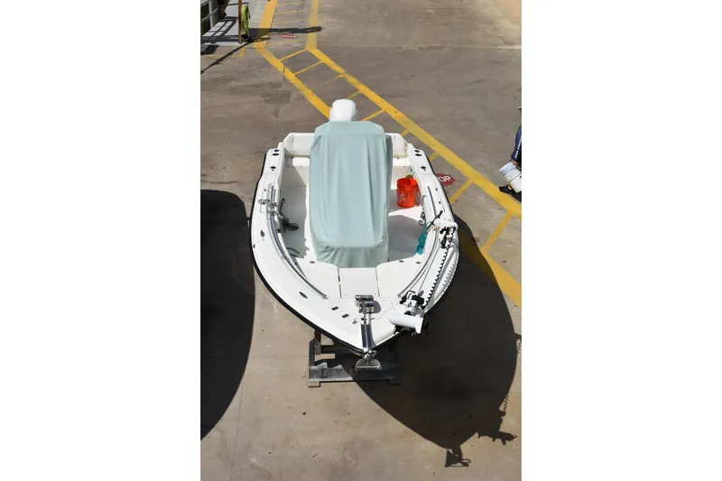 Slide: The Image of 2022 Key West 219 FS boat on display in a showroom setting. - 44