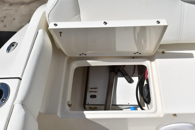Slide: The Image of Open storage compartment on a 2022 Key West 219 FS boat, showing interior details. - 6