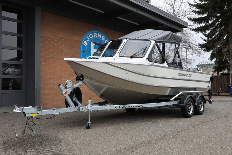 Slide: The Image of 2026 Thunder Jet 200 Luxor boat on trailer outside building. - 15