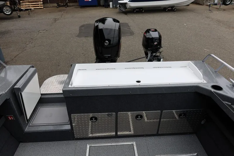 Slide: The Image of 2026 Thunder Jet 200 Luxor boat interior with dual outboard motors and storage compartments. - 20