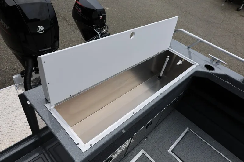 Slide: The Image of 2026 Thunder Jet 200 Luxor boat with open storage compartment and dual Mercury engines. - 21