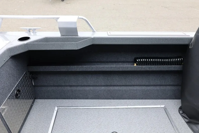 Slide: The Image of Interior view of 2026 Thunder Jet 200 Luxor boat, featuring storage and seating area. - 27