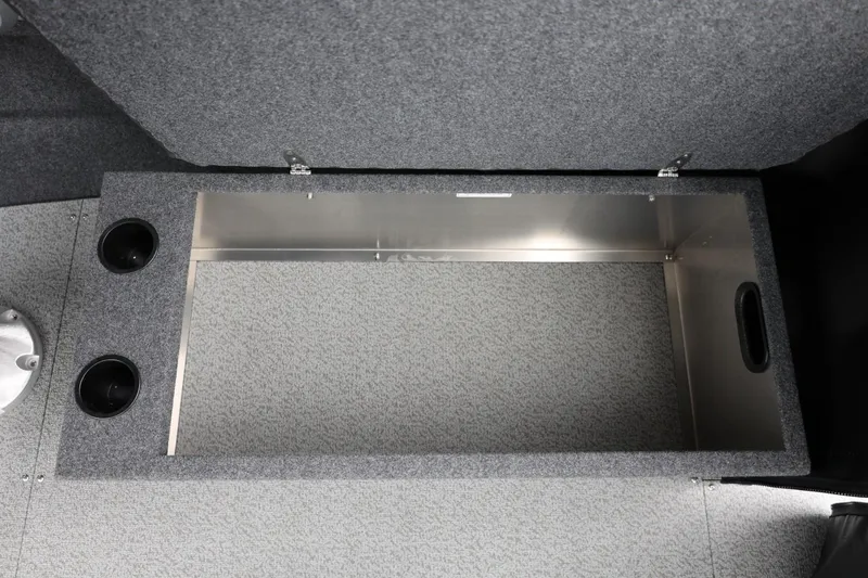 Slide: The Image of Storage compartment in 2026 Thunder Jet 200 Luxor boat, featuring carpeted interior and cup holders. - 34