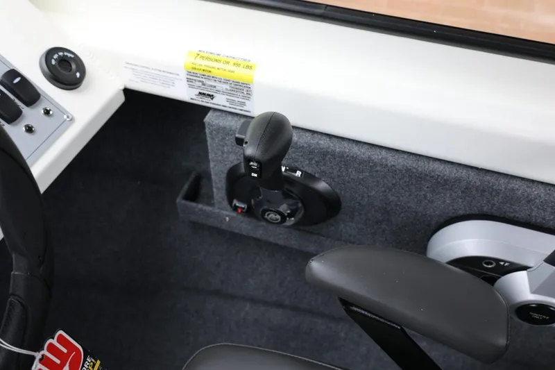 Slide: The Image of Interior controls of 2026 Thunder Jet 200 Luxor boat, featuring steering and throttle. - 37