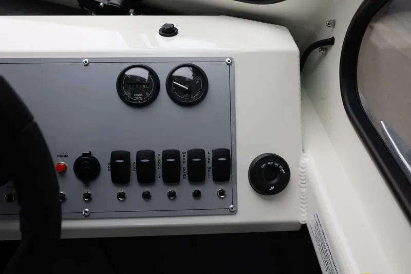 Slide: The Image of Control panel of 2026 Thunder Jet 200 Luxor boat with gauges and switches. - 38