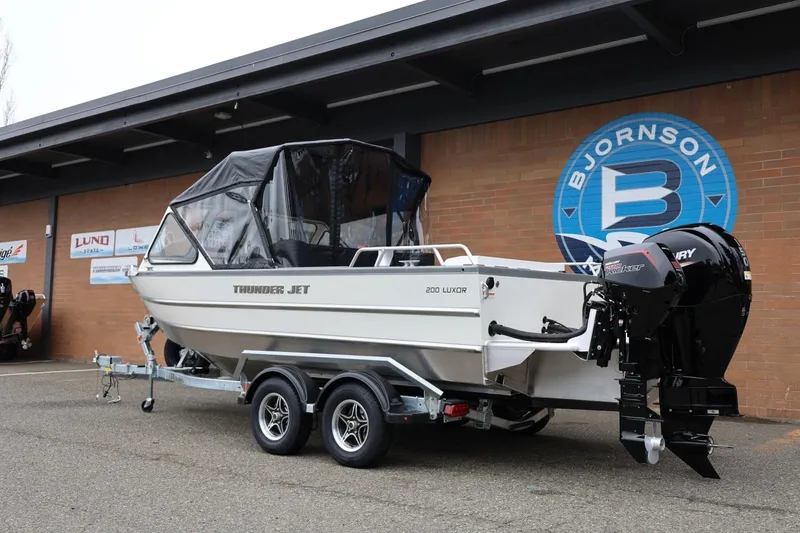 Slide: The Image of 2026 Thunder Jet 200 Luxor boat on trailer outside Bjornson dealership. - 4