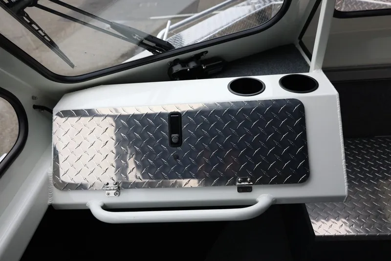 Slide: The Image of Interior of 2026 Thunder Jet 200 Luxor boat with diamond plate storage and cup holders. - 42