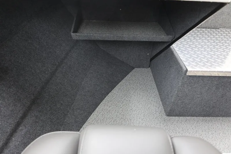Slide: The Image of Interior of 2026 Thunder Jet 200 Luxor boat with carpeted flooring and metal step. - 43
