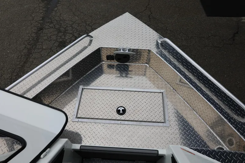 Slide: The Image of 2026 Thunder Jet 200 Luxor boat deck with diamond plate finish, showcasing storage hatch. - 48