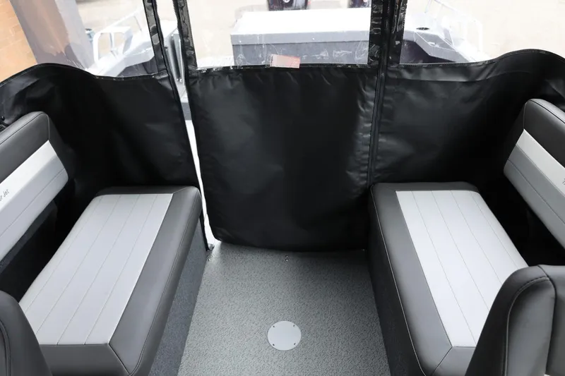 Slide: The Image of Interior seating of 2026 Thunder Jet 200 Luxor boat, featuring gray and black upholstery. - 50