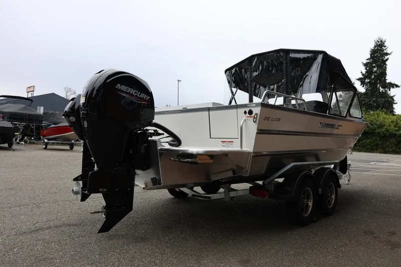 Slide: The Image of 2026 Thunder Jet 200 Luxor boat on trailer with Mercury outboard motor. - 9