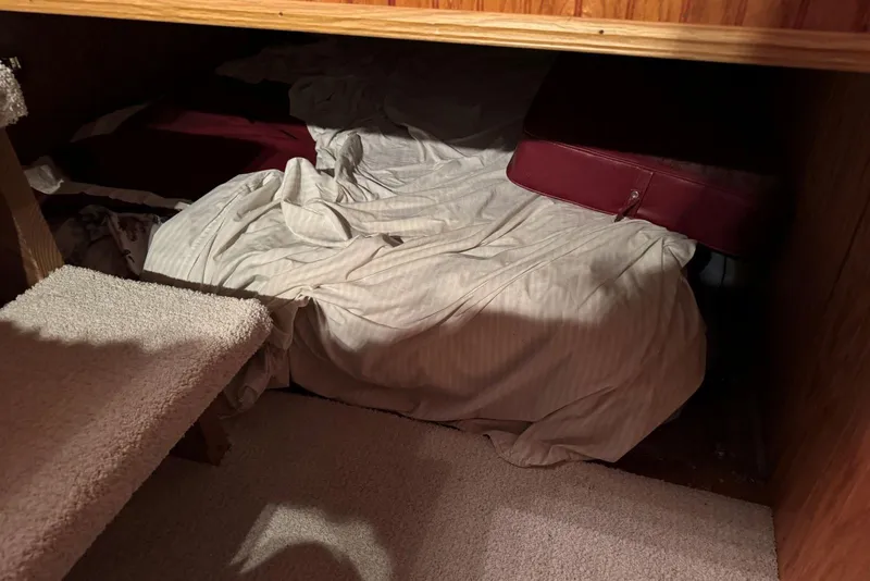 Slide: The Image of Cozy sleeping area in 1987 Stardust Cruisers 14 x 54 houseboat with carpeted steps. - 27