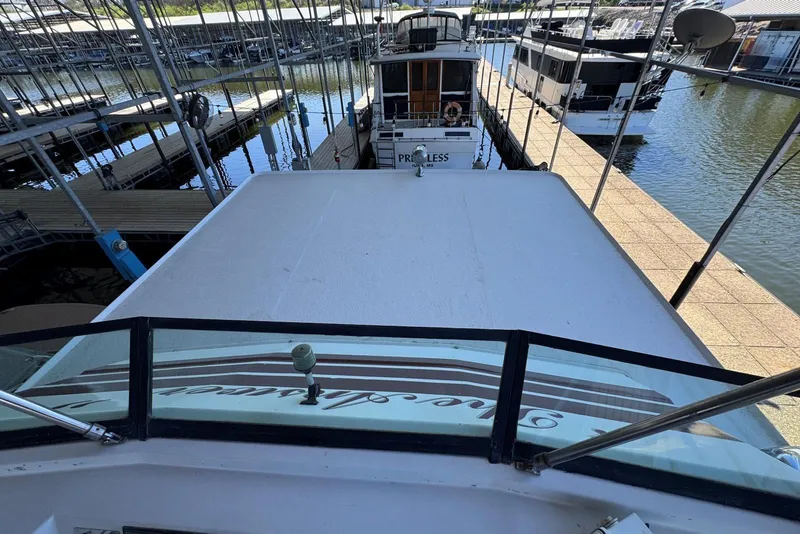 Slide: The Image of 1987 Stardust Cruisers 14 x 54 houseboat docked at marina, view from upper deck. - 53