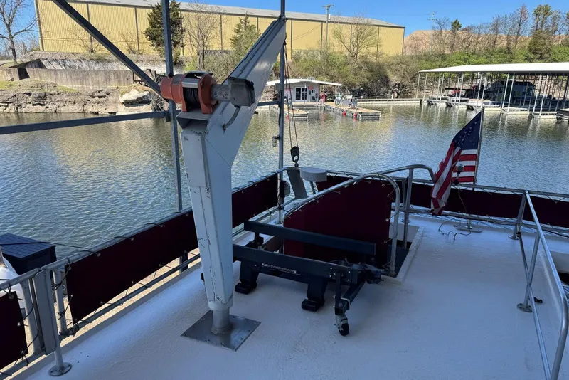 Slide: The Image of 1987 Stardust Cruisers 14 x 54 houseboat deck with crane and American flag. - 57