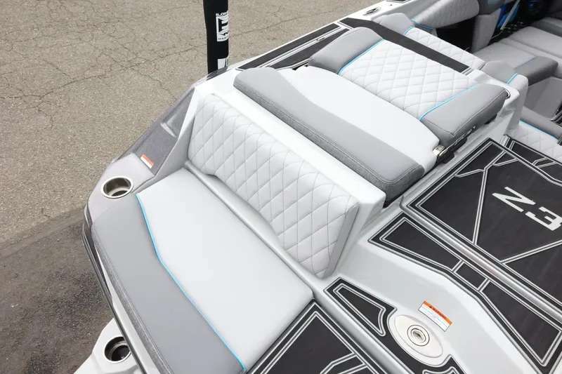 Slide: The Image of 2026 Tigé Z3 boat interior with quilted seating and cup holders. - 12