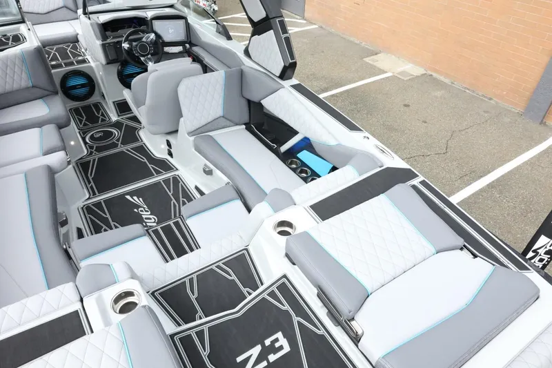 Slide: The Image of 2026 Tigé Z3 boat interior with modern seating and sleek dashboard design. - 15