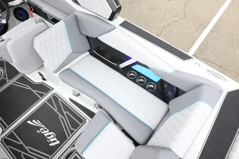 Slide: The Image of Luxurious interior of 2026 Tigé Z3 boat with quilted seating and cup holders. - 17