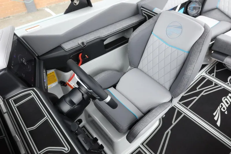 Slide: The Image of 2026 Tigé Z3 boat interior with modern steering wheel and luxurious seating. - 24