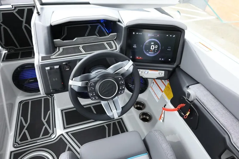 Slide: The Image of 2026 Tigé Z3 boat cockpit with modern steering wheel and digital dashboard display. - 25