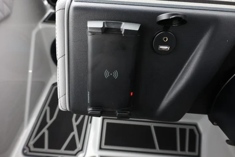 Slide: The Image of 2026 Tigé Z3 dashboard with wireless charging pad and USB port. - 34