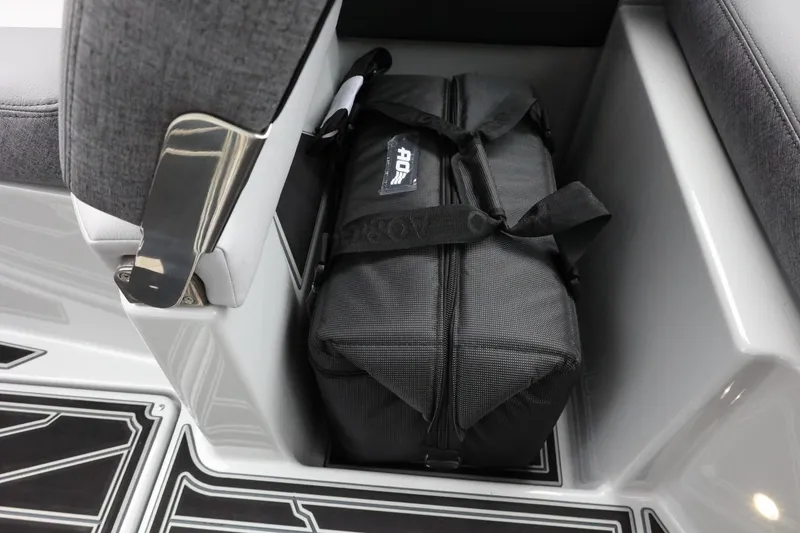 Slide: The Image of 2026 Tigé Z3 boat interior with storage compartment and black bag. - 37
