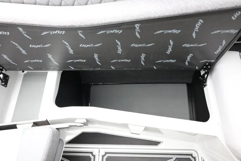 Slide: The Image of 2026 Tigé Z3 boat storage compartment with branded interior lining. - 40