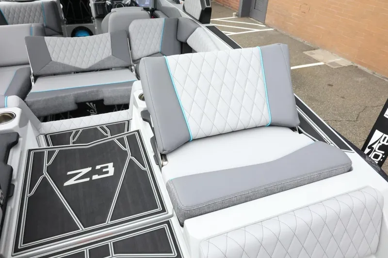 Slide: The Image of 2026 Tigé Z3 boat interior with stylish gray seating and diamond stitching. - 48
