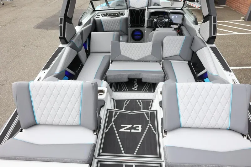 Slide: The Image of 2026 Tigé Z3 boat interior with luxurious gray seating and modern dashboard design. - 49