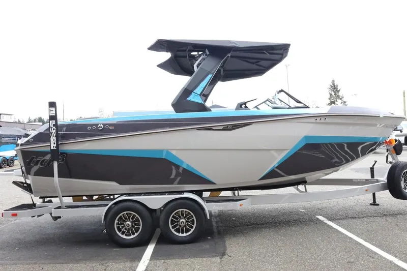 Slide: The Image of 2026 Tigé Z3 boat on trailer, featuring sleek design and modern graphics. - 6