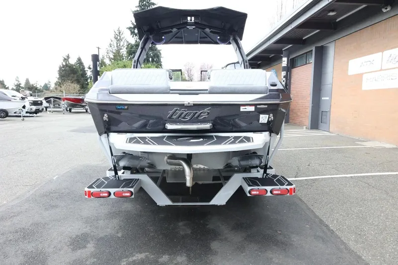 Slide: The Image of 2026 Tigé Z3 boat rear view in parking lot, showcasing sleek design and features. - 9